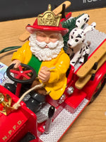 Hallmark 1996 North Pole Volunteers, Magic --Firefighter Santa & Dalmartion on Firetruck Ornament  Used Excellent