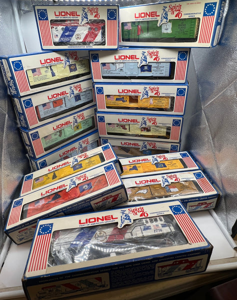 Lionel 6-1776, 6-7600, 6-7601, 6-7602, 6-7603, 6-7604, 6-7605, 6-7606, 6-7607, 6-7608, 6-7609, 6-7610, 6-7611, 6-7612, 6-7613 Spirit of 76 Locomotive, Caboose, and Box Car Set (Set of 15 Pcs) O Scale NEW