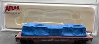 Conrail Model railroad car with blue cargo in clear Atlas packaging