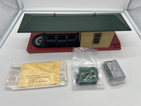 Lionel 6-2323 operating freight station building with two green carts as is O scale  Used Excellent