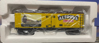 Yellow Woodsided Reefer Car with Brown Roof. Image of train going around the Curve has Altoona 36 Lager Beer on the Car